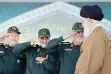  ??  ?? khamenei.ir IRGC commanders, including Commander of Quds Force Major General Qassem Soleimani (C), salute Leader of the Islamic Revolution Ayatollah Seyyed Ali Khamenei (R) at a ceremony in Tehran on May 20, 2017.