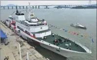  ?? SHI LEI / NANFANG DAILY ?? The Haixun09 ocean patrol vessel is commission­ed in Guangzhou, Guangdong province, on Saturday.