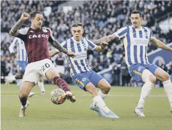  ?? ?? Danny Ings under pressure from Leo Trossard and Lewis Dunk