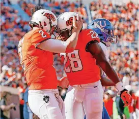  ?? [PHOTO BY NATE BILLINGS, THE OKLAHOMAN] ?? Oklahoma State’s Mason Rudolph (2) and James Washington (28) are both in Atlanta for Thursday’s college football awards show. Washington is a finalist for the Biletnikof­f Award and Rudolph is up for the Davey O’Brien Award.