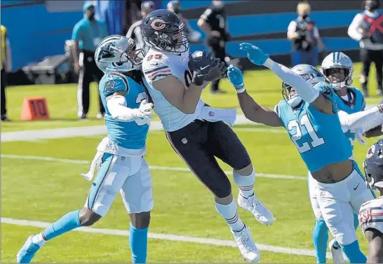  ?? MIKE MCCARN/AP ?? Cole Kmet catches a touchdown pass against the Panthers on Oct. 18, his only touchdown of the season. He had one catch Monday against the Vikings despite playing 70% of the snaps.