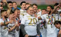  ??  ?? Champions… Leeds sealed the Championsh­ip title back in July