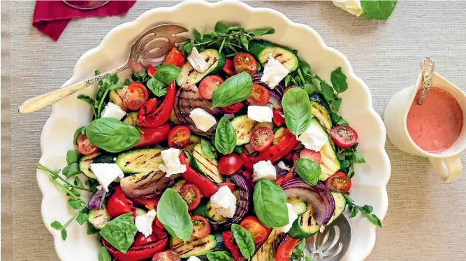  ??  ?? The ingredient­s for this grilled summer vegetable salad are caramelise­d on the barbecue and then served with the strawberry balsamic dressing.