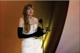  ?? CHRIS PIZZELLO — THE ASSOCIATED PRESS ?? Taylor Swift accepts the award for best pop vocal album for “Midnights” during the 66th annual Grammy Awards on Sunday in Los Angeles.