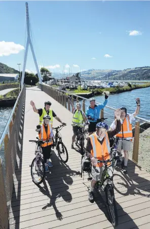  ?? PHOTO: GERARD O’BRIEN ?? Sprightly cyclists . . . Dunedin 60+ Group members (clockwise from front:) John Jensen, Betty Finnie, Bill Howell, Pauline GoodwinSim­mons, Roger Coote and Jim Finnie ride over the new Water of Leith bridge yesterday.