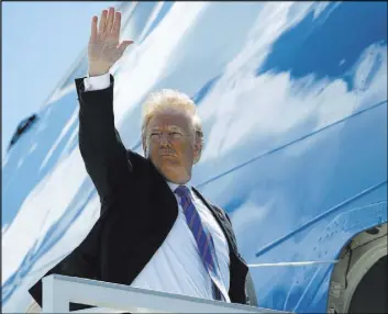  ?? Evan Vucci The Associated Press ?? President Donald Trump boards Air Force One for a trip Saturday at Canadian Forces Base to Singapore to meet with North Korean leader Kim Jong Un.