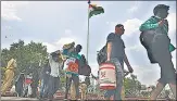  ?? AP ?? Migrants outside a railway station in Hyderabad.