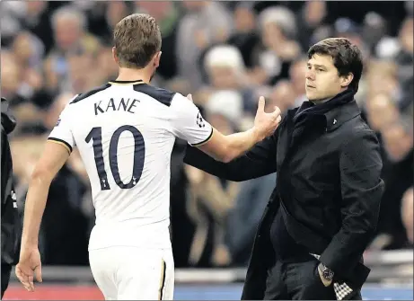  ?? Picture: REUTERS ?? GOOD ON YOU, ‘ARRY: Tottenham striker Harry Kane, with boss Mauricio Pochettino, is back in dangerous form and has scored seven goals in his last six Premier League outings.