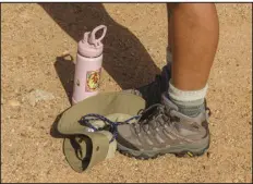  ?? ?? A hiker’s bottle and hat on the ground while taking a break at Will Rogers State Historic Park.