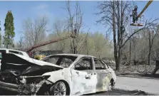  ?? — AFP ?? Workers repair power line in Zaporizhzh­ia after night shelling on April 6.