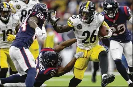  ?? TIM WARNER / GETTY IMAGES ?? Le’Veon Bell rushed for 69 yards and a touchdown as the Steelers trampled the Texans 34-6 on Monday in Houston.