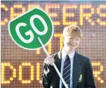  ?? PHOTOS: PETER MCINTOSH ?? Stop, go . . . Considerin­g a job as a roadworker is Bayfield High School pupil Obie Geary (15).