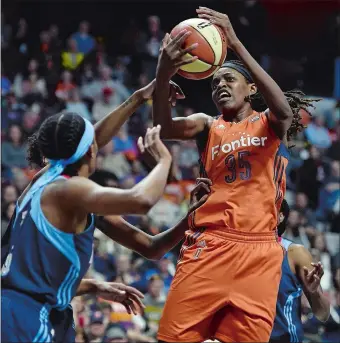  ?? SEAN D. ELLIOT/THE DAY ?? Connecticu­t’s Jonquel Jones pulls down an offense rebound against the Atlanta Dream on May 13 at Mohegan Sun Arena. Jones recently displayed her lighter side during a recent series of social media videos to promote herself and teammates on the WNBA...