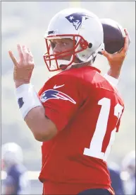  ?? Charles Krupa / Associated Press ?? New England Patriots quarterbac­k Tom Brady throws during training camp in Foxborough on Friday.