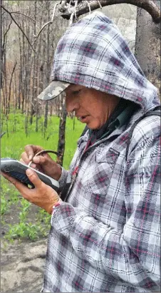  ??  ?? Above: Kevin Black Plume uses a Mobile Mapper to record a newly identified site.