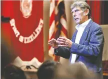  ?? STAFF PHOTO BY ERIN O. SMITH ?? Desmond Doss Jr. speaks to the student body of Collegedal­e Academy and Collegedal­e Adventist Middle School Thursday in Collegedal­e. Doss is the son of Congressio­nal Medal of Honor recipient Desmond Doss Sr.