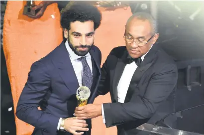  ?? Picture: AFP ?? ACCOLADE. Caf president Ahmad Ahmad (right) presents Mohamed Salah with the African Footballer-of-theYear award at the Caf Awards in Accra on Thursday night.