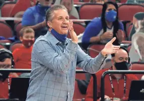  ?? SCOTT UTTERBACK/LOUISVILLE COURIER JOURNAL ?? Kentucky coach John Calipari reacts during the Wildcats’ game against Louisville on Saturday.