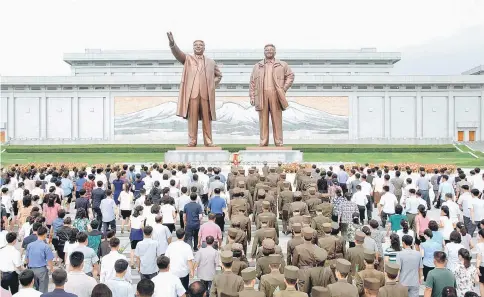  ?? — Reuters photo ?? People gather to mark the occasion of the 23rd anniversar­y of the demise of the country’s founding father Kim Il Sung in this photo released by North Korea’s Korean Central News Agency in Pyongyang on Saturday.