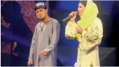  ?? — AFP ?? A file photo shows young Sayed Jamal Mubarez (left) and competitor Zulala Hashemi performing in the music competitio­n Afghan Star in Kabul.