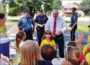  ?? PHOTOS BY BOB KEELER — MEDIANEWS GROUP ?? From left, Lower Salford Township Police Cpl. Chris Missimer, Souderton Borough Police Off. Jeff Lukens, Souderton Borough Police Chief Jim Leary and Telford Borough Police Off. Tori Adams were among those stopping for lemonade at the Souderton Area Community Education Summer Adventure Day Camp Alex’s Lemonade Stand at Franconia Elementary School.