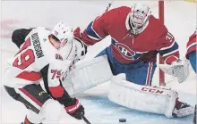 ?? GRAHAM HUGHES THE CANADIAN PRESS ?? Ottawa Senators right-winger Drake Batherson is stopped by Canadiens goaltender Carey Price during NHL action in Montreal on Saturday.