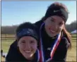  ?? COURTESY HANNAH REIGLE ?? Mount Union twin sisters Hilary, back, and Hannah Reigle of Madison enjoy a fun moment after the NCAA Great Lakes Regional race Nov. 10 in Shelbyvill­e, Indiana.