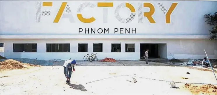  ??  ?? Adaptive reuse: The facade of Phnom Penh’s latest co-working space, the Factory.