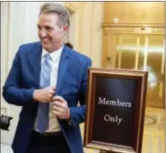  ?? ANDREW HARNIK — THE ASSOCIATED PRESS ?? Sen. Jeff Flake, R-Ariz., walks on to the Senate floor on Capitol Hill in Washington, Tuesday after announcing he won’t seek re-election in 2018.