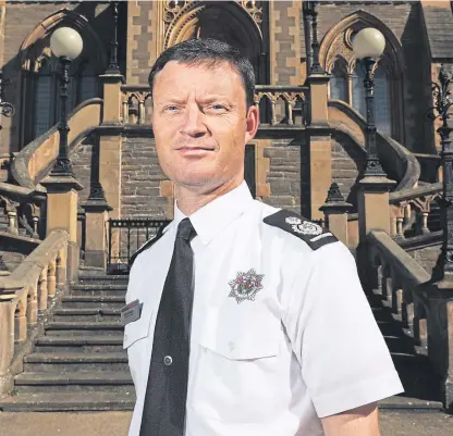  ?? Pictures: Mhairi Edwards. ?? Above: Iain Bushell, Scottish Fire and Rescue Service depute chief officer. Below: fire crews at the Strathmart­ine farm fire.