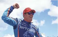  ?? MIKE DINOVO / USA TODAY SPORTS ?? New Zealand’s Scott Dixon celebrates his Kohler Grand Prix win at Road America on Sunday.