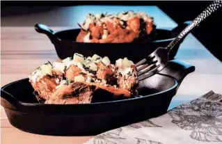  ??  ?? A loaded baked potato becomes dinner all by itself. Here, sweet potatoes take the place of russets, and Buffalo chicken wings inspire the toppings. Think crispy chicken nuggets, blue cheese and hot sauce.