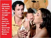  ??  ?? Juliana Finondo, 39, kisses her newborn daughter Emilia next to her husband Gerardo Tuya, in Buenos Aires