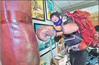  ?? ROSLAN RAHMAN / AFP ?? Brooks Entwistle performs hypoxic boxing training in preparatio­n for his attempt to reach the summit of Qomolangma.