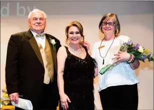  ?? Submitted photo ?? Longtime volunteers and supporters of the Stadium Theatre, John and Barbara Gregory, were chosen as the 2018 recipients of the Francis L. Lanctot Award. From left to right, John Gregory, CEO &amp; President of the Northern Rhode Island Chamber of Commerce, Cathy Levesque, Stadium Theatre Executive Director/CEO, and Barbara Gregory.