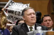  ?? OLIVIER DOULIERY/ABACA PRESS ?? Code Pink activists protest secretary of state nominee Mike Pompeo during his Senate Foreign Relations Committee hearing on April 12.