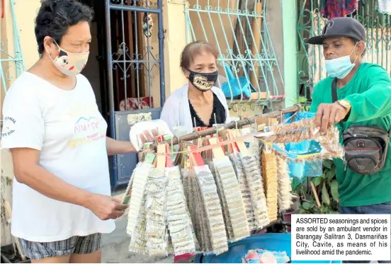  ??  ?? ASSORTED seasonings and spices are sold by an ambulant vendor in Barangay Salitran 3, Dasmariñas City, Cavite, as means of his livelihood amid the pandemic.