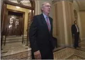  ?? PHOTO/J. SCOTT APPLEWHITE ?? Senate Majority Leader Mitch McConnell of Ky. leaves the Senate chamber on Capitol Hill in Washington on Thursday after a vote as the Republican majority in Congress remains stymied by their inability to fulfill their political promise to repeal and...