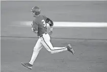 ?? BRYAN TERRY/THE OKLAHOMAN ?? Oklahoma's Jimmy Crooks rounds the bases after hitting a home run in a Bedlam baseball game against Oklahoma State.