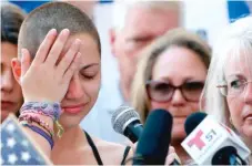  ??  ?? Emma Gonzalez, a student at Marjory Stoneman Douglas High School where 17 people were killed Wednesday, reacts during her speech at a rally for gun control in Fort Lauderdale, Fla., on Saturday.
| RHONA WISE/ AFP/ GETTY IMAGES