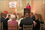  ??  ?? President of The Junior League of Troy Michelle Hogan welcomes the crowd at the Franklin Plaza Ballroom Thursday night for its Polly Mason community service award dinner.