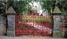  ?? — AFP photos ?? Graffiti is pictured on the posts and the gates to Strawberry Field in Liverpool, northwest England.