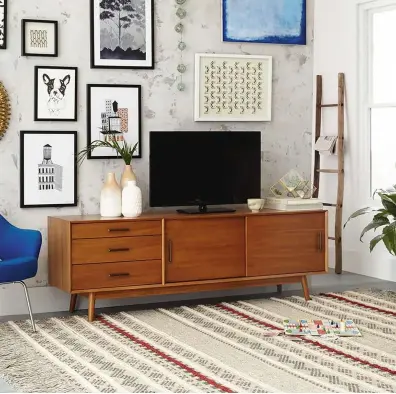  ??  ?? LEFT Storage comes in styles based on classic 60s and 70s furniture. ‘Mid- century Media Console’ (203cm) in acacia wood and eucalyptus, £1,599, West Elm