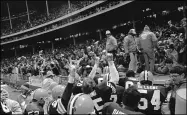  ?? ASSOCIATED PRESS FILE ?? Browns players and their fans celebrate after the team beat the Steelers, 27-26, on Oct. 26, 1980 at Cleveland Municipal Stadium.