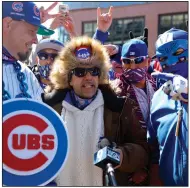  ?? (AP/Shafkat Anowar) ?? Chicago Cubs fans gather outside of Wrigley Field in Chicago for Thursday’s opener between the Cubs and the Pittsburgh Pirates. Fans are back at the ballpark after they were shut out during the regular season last year because of the coronaviru­s pandemic.