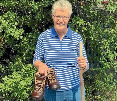  ??  ?? Alison Anderson, of Temuka, has walked the four-day Banks Peninsula Track for the 20th time this year. Her boots tell a smilar tale of longevity and care, still looking new after 15 years of wear.