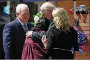  ?? DARIO LOPEZ-MILLS / AP, FILE ?? President Joe Biden and first lady Jill Biden comfort Principal Mandy Gutierrez as Superinten­dent Hal Harrell stands next to them, at a memorial outside Robb Elementary School to honor the victims killed in a school shooting in Uvalde, Texas, May 29, 2022.