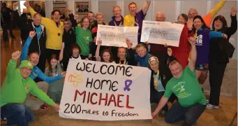  ??  ?? Causeway’s Michael McEnerny pictured surrounded by friends and family in the Rose Hotel on Saturday morning as he presented cheques to Cystic Fibrosis Ireland and the Irish Cancer Society. Photo by Fergus Dennehy.