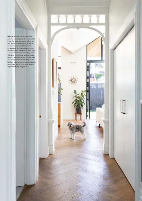  ??  ?? HALLWAY This renovation also saw the existing laundry separated from the bathroom and rehomed in a nook in the hallway in place of some redundant brickwork. As a result, the bathroom is now spacious and functional, with both a shower and a freestandi­ng bath. “Finding room for a tucked-away laundry and having the dishwasher and fridge behind panelling in the kitchen means we’re not constantly reminded about the more menial aspects of life,” says Gez.