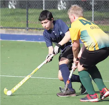  ?? ?? Drouids player Steven McNamara takes possession of the ball in a contest with Gulls player Jacob Graziotin in the under 15s game on Saturday morning.